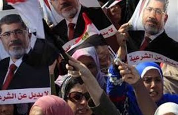 Morsy's supporters beat Christian young lady and her infant